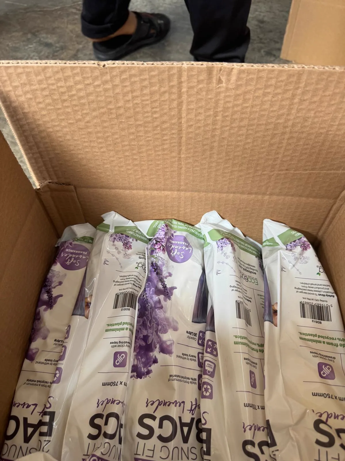 Lavender-scented trash bag rolls packed for shipping